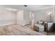 Bright living area with wood-look floors, neutral paint, and comfortable seating at 9812 N Pawnee Ave, Tampa, FL 33617