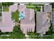 Aerial view of home featuring fenced yard, screened pool and mature landscaping at 10309 Marchmont Ct, Tampa, FL 33626