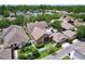 Aerial view of a home with a screened pool, fenced yard, and play area at 10309 Marchmont Ct, Tampa, FL 33626
