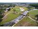 Scenic aerial view of the golf course with a bridge crossing over a waterway and lush green surroundings at 10309 Marchmont Ct, Tampa, FL 33626