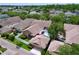 Expansive home featuring a screened-in pool, lush landscaping, and mature trees in a desirable neighborhood at 10309 Marchmont Ct, Tampa, FL 33626