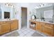 Bathroom features double sinks, vanity area, and tile flooring at 10309 Marchmont Ct, Tampa, FL 33626
