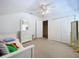 Bright bedroom with neutral tones, ample closet space, and ceiling fan at 10309 Marchmont Ct, Tampa, FL 33626
