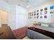 Cozy bedroom features a ceiling fan, wall decor, a comfortable bed and an access door at 10309 Marchmont Ct, Tampa, FL 33626
