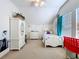 Bedroom with a ceiling fan, neutral carpet, white furniture, and decor at 10309 Marchmont Ct, Tampa, FL 33626