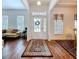 Bright foyer with hardwood floors leading to the living room and dining area at 10309 Marchmont Ct, Tampa, FL 33626
