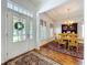 Bright foyer with hardwood floors, a dining room, and natural light at 10309 Marchmont Ct, Tampa, FL 33626