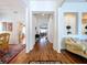 Long hallway with hardwood floors connecting various living spaces at 10309 Marchmont Ct, Tampa, FL 33626