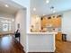 Bright kitchen featuring white countertops, light wood cabinets, and seamless breakfast bar at 10309 Marchmont Ct, Tampa, FL 33626
