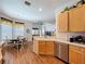 Eat-in kitchen features wood floors, stainless appliances, and breakfast nook at 10309 Marchmont Ct, Tampa, FL 33626
