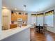 Spacious kitchen with white countertops, light wood cabinets, and adjacent breakfast nook at 10309 Marchmont Ct, Tampa, FL 33626