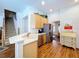 Bright kitchen with wood floors, light wood cabinets, and stainless steel appliances at 10309 Marchmont Ct, Tampa, FL 33626