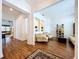 Bright living room featuring hardwood floors, comfortable seating, and a decorative bookshelf at 10309 Marchmont Ct, Tampa, FL 33626