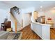 Open-concept living area with a staircase and hardwood floors at 10309 Marchmont Ct, Tampa, FL 33626