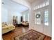 Comfortable living room with a view of the front door and hardwood floors at 10309 Marchmont Ct, Tampa, FL 33626