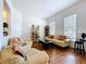 Spacious living room with hardwood floors, natural light, and classic furnishings at 10309 Marchmont Ct, Tampa, FL 33626