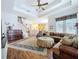 Open concept living room with staircase, piano, and views of the kitchen at 10309 Marchmont Ct, Tampa, FL 33626