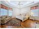 Relaxing main bedroom featuring wood floors and ample natural light at 10309 Marchmont Ct, Tampa, FL 33626