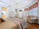Tranquil main bedroom with tray ceilings, plush seating area, and wood floors at 10309 Marchmont Ct, Tampa, FL 33626