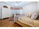 Spacious main bedroom featuring tray ceiling, a ceiling fan, and plenty of natural light at 10309 Marchmont Ct, Tampa, FL 33626