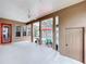 Enclosed patio with a ceiling fan, exterior access to the pool area, and a neutral colored flooring at 10309 Marchmont Ct, Tampa, FL 33626
