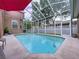 Pool area featuring a screen enclosure with a lush backyard view, for ultimate privacy at 10309 Marchmont Ct, Tampa, FL 33626