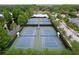 Overhead view of community tennis courts, perfectly maintained for active leisure and social play at 10309 Marchmont Ct, Tampa, FL 33626