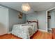Serene bedroom with a modern light fixture, gray walls, and cozy decor touches at 1041 Persimmon Dr, Palm Harbor, FL 34683