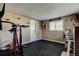 Versatile exercise room with gym equipment, natural light, and a clean rubber floor at 1041 Persimmon Dr, Palm Harbor, FL 34683