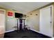 Exercise room with rubber floor, exercise machine, closet and doorway to another room at 1041 Persimmon Dr, Palm Harbor, FL 34683