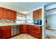 A kitchen features stainless steel appliances and plenty of cabinet space at 1041 Persimmon Dr, Palm Harbor, FL 34683