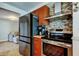 A kitchen showcasing stainless steel appliances, wood cabinets, and an open layout at 1041 Persimmon Dr, Palm Harbor, FL 34683