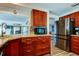 Well-equipped kitchen with modern appliances and abundant storage, and convenient layout at 1041 Persimmon Dr, Palm Harbor, FL 34683