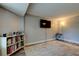 Light and bright living room features hardwood floors, large TV, and neutral wall color at 1041 Persimmon Dr, Palm Harbor, FL 34683
