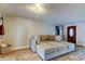 Living room with a large sectional sofa and interior door with decorative glass panel at 1041 Persimmon Dr, Palm Harbor, FL 34683