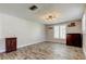 Open living room featuring wood-look flooring, neutral paint, and natural light from window at 1041 Persimmon Dr, Palm Harbor, FL 34683