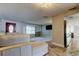 Inviting living room with wood floors, a large window, and a comfortable couch at 1041 Persimmon Dr, Palm Harbor, FL 34683