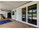 Outdoor patio with bar, pool view, refrigerator, ceiling fan and sliding glass door at 1041 Persimmon Dr, Palm Harbor, FL 34683