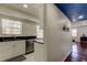 This bright kitchen features white cabinets, black countertops, and stainless steel appliances at 1115 Rue Des Chateaux # 2B, South Pasadena, FL 33707