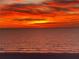 Stunning ocean view featuring a vibrant sunset and calm water at 1115 Rue Des Chateaux # 2B, South Pasadena, FL 33707