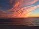 Picturesque beach view showcasing a colorful sunset and tranquil ocean at 1115 Rue Des Chateaux # 2B, South Pasadena, FL 33707