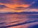 Gorgeous sunset view over the water with colorful clouds reflecting on the ocean at 1115 Rue Des Chateaux # 2B, South Pasadena, FL 33707