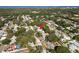 Aerial view of a residential neighborhood, showing the property's location among mature trees near the bay at 1152 Jackmar Rd, Dunedin, FL 34698