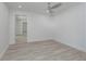 Spacious bedroom with new floors, a ceiling fan and recessed lighting at 1152 Jackmar Rd, Dunedin, FL 34698