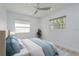 Bedroom featuring new floors, a ceiling fan and bright natural light at 1152 Jackmar Rd, Dunedin, FL 34698