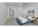 Stylishly furnished bedroom with new floors and light blue accents at 1152 Jackmar Rd, Dunedin, FL 34698