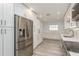 Modern kitchen with stainless steel appliances, white cabinetry, and ample counter space at 1152 Jackmar Rd, Dunedin, FL 34698
