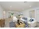 Bright and spacious living room featuring modern decor, plush seating, and an open floor plan at 1152 Jackmar Rd, Dunedin, FL 34698