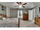 Bedroom with a ceiling fan, a window, neutral color scheme, and carpeted floors at 11707 Sunburst Marble Rd, Riverview, FL 33579