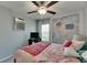 A bright bedroom features a ceiling fan, and stylish wall decor at 11707 Sunburst Marble Rd, Riverview, FL 33579